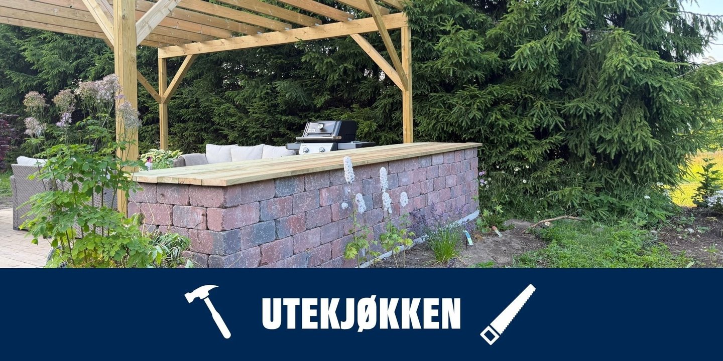 Utekjøkken av stein i grønne omgivelser