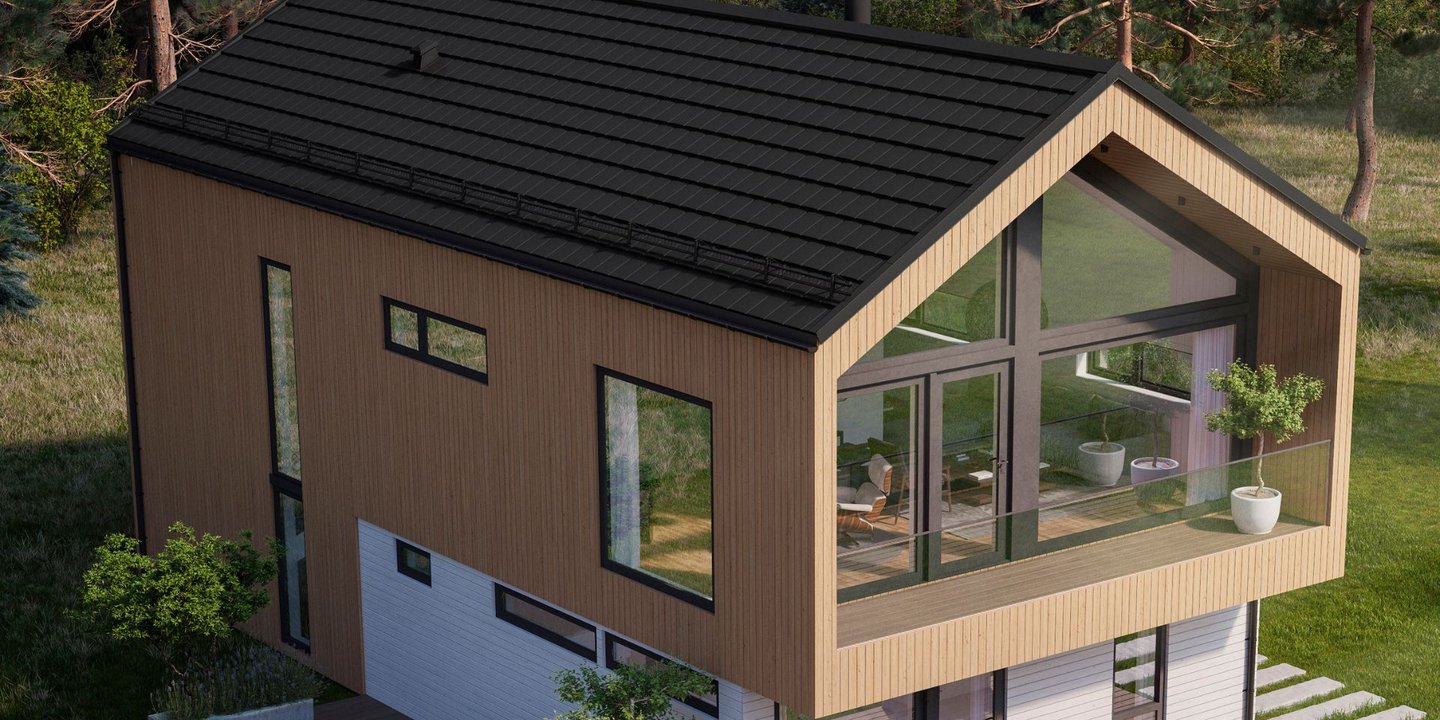 Et moderne brunt trehus med svart tak fra Isola. Hele fronten av huset har store glassvinduer.